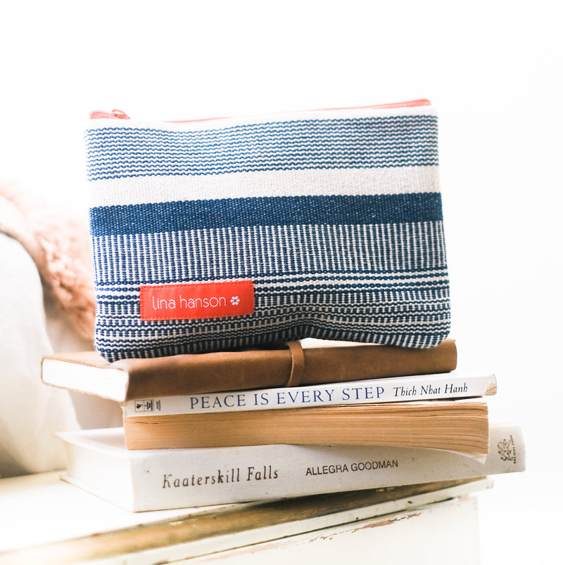 A handwoven accessory bag using natural indigo dyes. Made in Thailand by Studio Naenna 